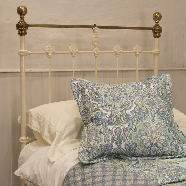 single antique bed in cream
