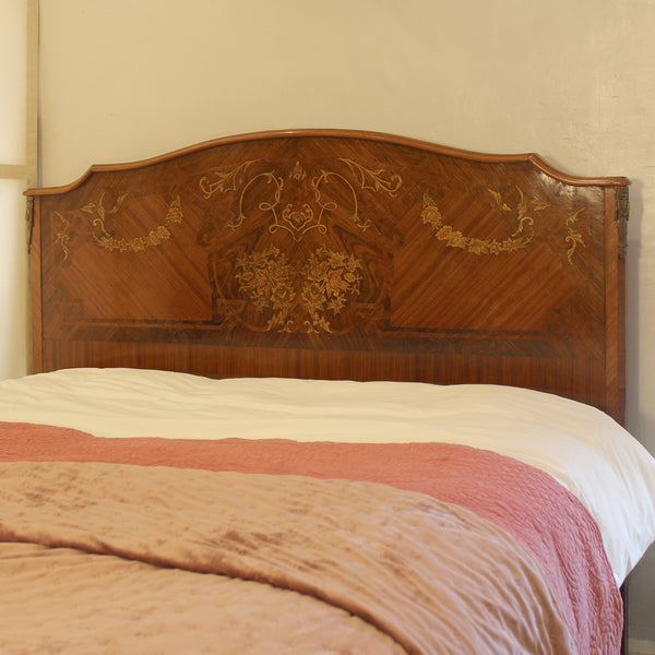 Close up of mahogany antique bed