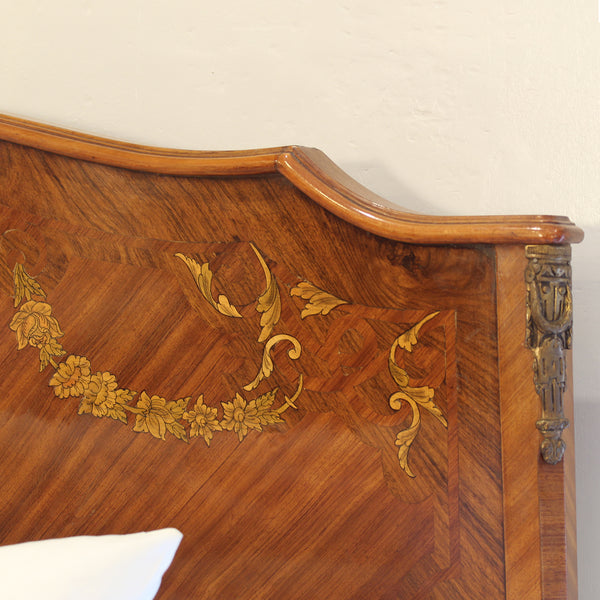Close up of mahogany antique bed