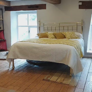 A video of a 6ft wide super king size Victorian all brass antique bed with low foot board.